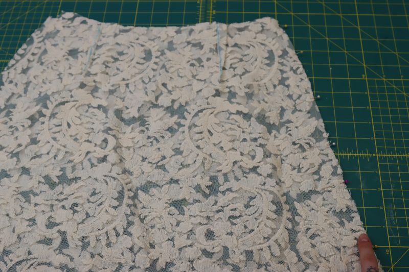 How To Pin Sew One Side Seam - Embroidered Lace - Mood Fabrics - Taiga Trapeze Skirt Free Sewing Pattern Tutorial - MDF512 - Mood Fabrics Sewciety Blog - Pin and sew one of the skirt side seams.