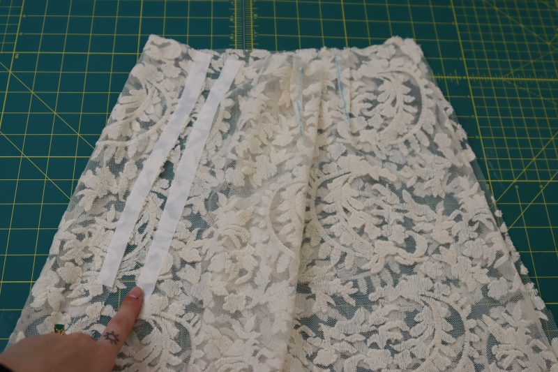 How To Iron Fusible Interfacing Strips - Fusible Interfacing - Mood Fabrics - Taiga Trapeze Skirt Free Sewing Pattern Tutorial - MDF512 - Mood Fabrics Sewciety Blog - Iron the fusible interfacing to the wrong sides of the open side seam of the skirt.