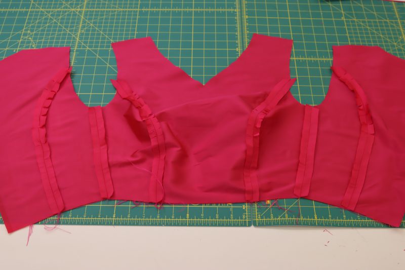 How To Sew Bodice Side Seams - Polyester Taffeta - Mood Fabrics - Biella Fit and Flare Dress Free Sewing Pattern Tutorial - MDF514 - Mood Fabrics Sewciety Blog - Sew the front and backs together at the side seams.