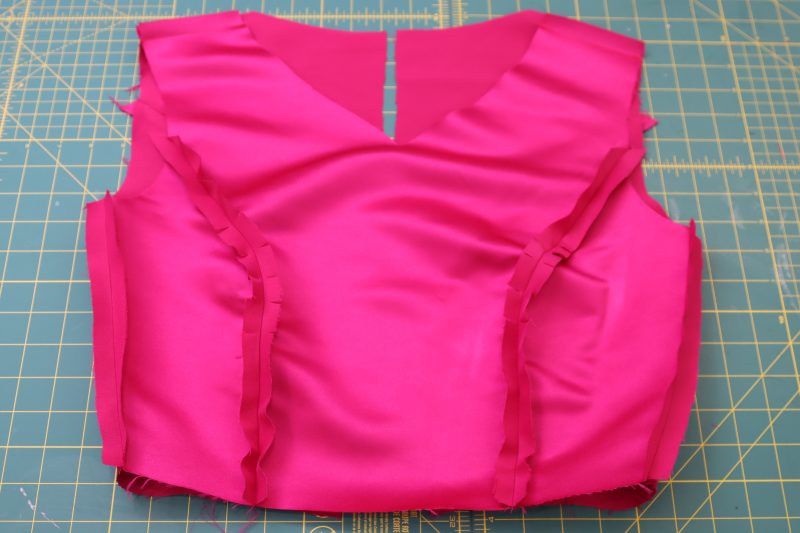 How To Sew Bodice Lining Wrong Sides Together - Polyester Satin - Mood Fabrics - Biella Fit and Flare Dress Free Sewing Pattern Tutorial - MDF514 - Mood Fabrics Sewciety Blog - Repeat the previous 3 steps for the lining.
