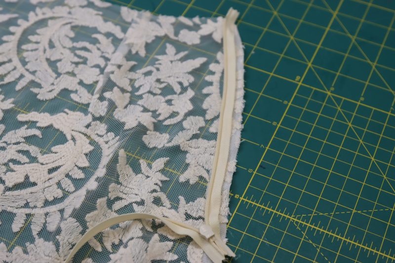 How To Sew Zipper Right Sides Together With Side Front - Invisible Zipper - Mood Fabrics - Taiga Trapeze Skirt Free Sewing Pattern Tutorial - MDF512 - Mood Fabrics Sewciety Blog - Sew the zipper to the front side seam of the skirt, teeth facing away from the raw edge.