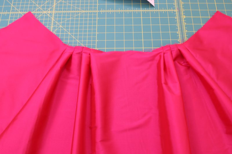 How To Topstitch Pleats - Polyester Taffeta - Mood Fabrics - Biella Fit and Flare Dress Free Sewing Pattern Tutorial - MDF514 - Mood Fabrics Sewciety Blog - Topstitch over the pleats after pressing.