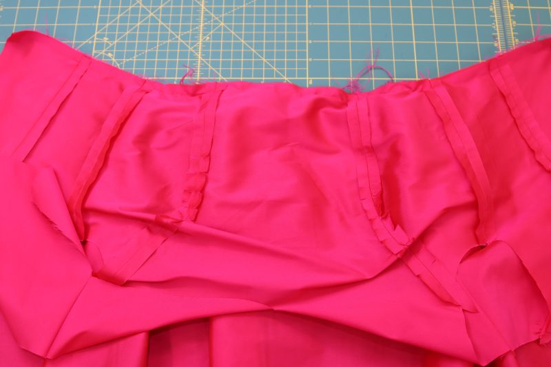 How To Pin Outer Skirt To Outer Bodice - Polyester Taffeta - Mood Fabrics - Biella Fit and Flare Dress Free Sewing Pattern Tutorial - MDF514 - Mood Fabrics Sewciety Blog - Pin the outer skirt to the outer bodice at the waistline.