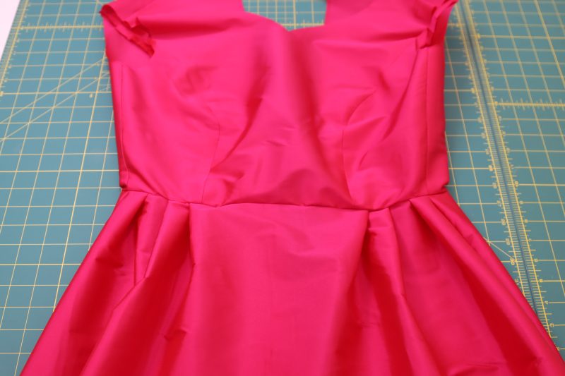 How To Sew Outer Skirt To Outer Bodice - Polyester Taffeta - Mood Fabrics - Biella Fit and Flare Dress Free Sewing Pattern Tutorial - MDF514 - Mood Fabrics Sewciety Blog - Sew the outer skirt to the outer bodice.