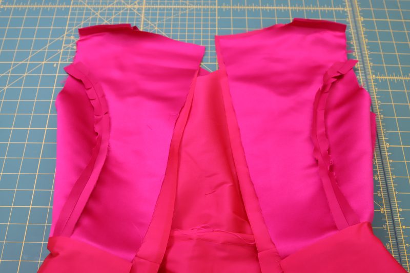 How To Place Lining Outer Dress Right Sides Together - Polyester Taffeta - Mood Fabrics - Biella Fit and Flare Dress Free Sewing Pattern Tutorial - MDF514 - Mood Fabrics Sewciety Blog - Place the lining dress and outer dress right sides together.