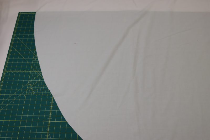 How To Cut Petticoat On Fold Using Lining Pattern - Cotton Voile - Mood Fabrics - Selenite V Waist Ballgown Free Sewing Pattern Tutorial - MDF515 - Mood Fabrics Sewciety Blog - Cut the petticoat on fold out of the same pattern piece as the skirt lining.