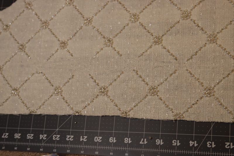 How To Remove Beads Around Darts On Back Of Dress - Beaded Tweed - Mood Fabrics - Deauville Cocktail Dress Free Sewing Pattern Tutorial - MDF517 - Mood Fabrics Sewciety Blog - Remove the beads around the darts on the back of the dress.