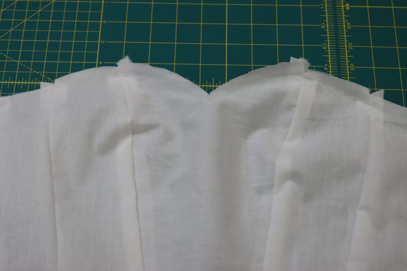 How To Pin And Sew Interfacing To Lining Bodice - Fusible Interfacing - Mood Fabrics - Selenite V Waist Ballgown Free Sewing Pattern Tutorial - MDF515 - Mood Fabrics Sewciety Blog - Pin and sew the interfacing bodice to the lining bodice wrong sides together.