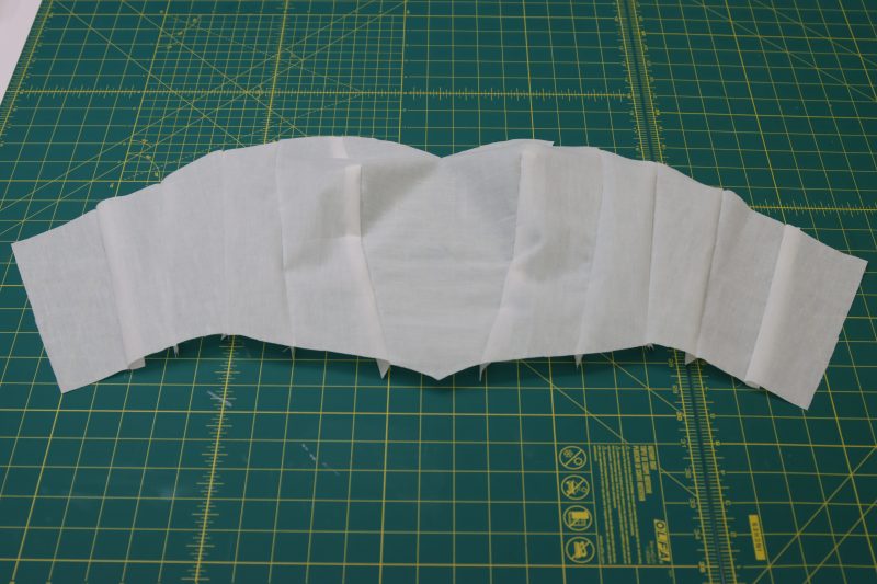 How To Sew Interfacing Bodice Same As Lining Without Pressing - Fusible Interfacing - Mood Fabrics - Selenite V Waist Ballgown Free Sewing Pattern Tutorial - MDF515 - Mood Fabrics Sewciety Blog - Sew the interfacing bodice the same way as the lining bodice, but without ironing anything.