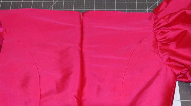How To Press Center Back Seam Flat - Polyester Taffeta - Mood Fabrics - Biella Fit and Flare Dress Free Sewing Pattern Tutorial - MDF514 - Mood Fabrics Sewciety Blog - Close the zipper and press the center back seam flat.