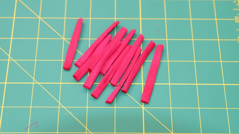 How To Cut Tubes Into Strips - Polyester Taffeta - Mood Fabrics - Biella Fit and Flare Dress Free Sewing Pattern Tutorial - MDF514 - Mood Fabrics Sewciety Blog - Cut the tube into strips that are 2.5 inches long.