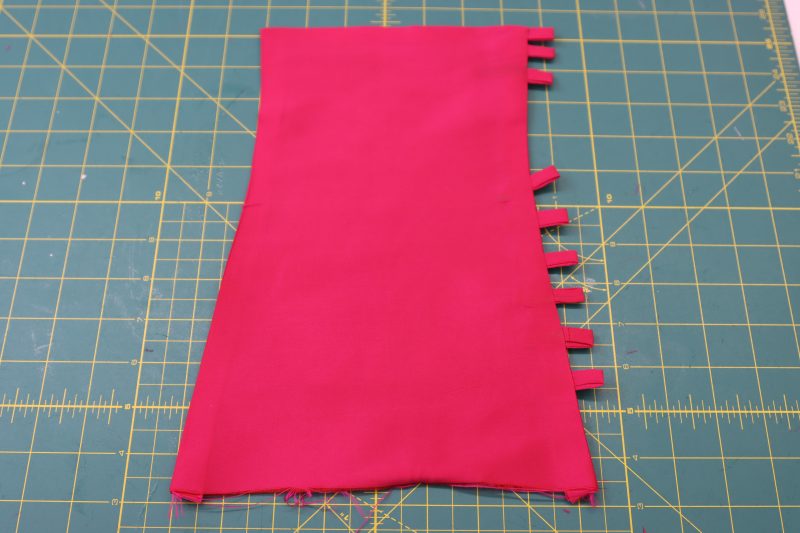 How To Flip Cuffs Right Sides Out - Polyester Taffeta - Mood Fabrics - Biella Fit and Flare Dress Free Sewing Pattern Tutorial - MDF514 - Mood Fabrics Sewciety Blog - Flip the cuff right sides out.