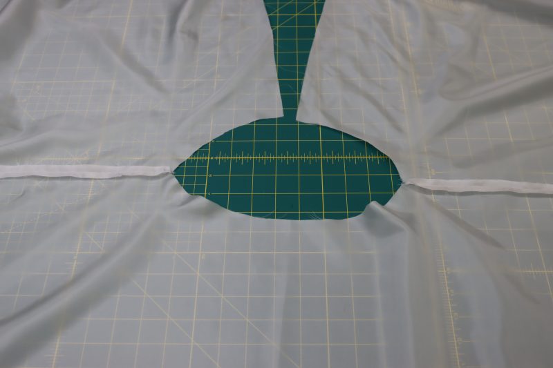 How To Press Lining Skirt Seams Open And Flat - Polyester Lining - Mood Fabrics - Selenite V Waist Ballgown Free Sewing Pattern Tutorial - MDF515 - Mood Fabrics Sewciety Blog - Press the lining side seams open and flat.
