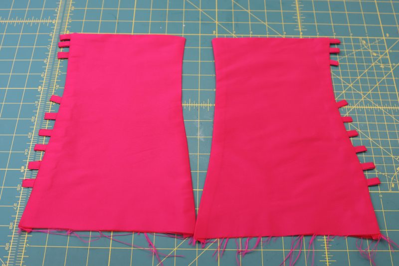 How To Sew Two Mirrored Cuffs - Polyester Taffeta - Mood Fabrics - Biella Fit and Flare Dress Free Sewing Pattern Tutorial - MDF514 - Mood Fabrics Sewciety Blog - Make two mirrored cuff pieces with the button loops.