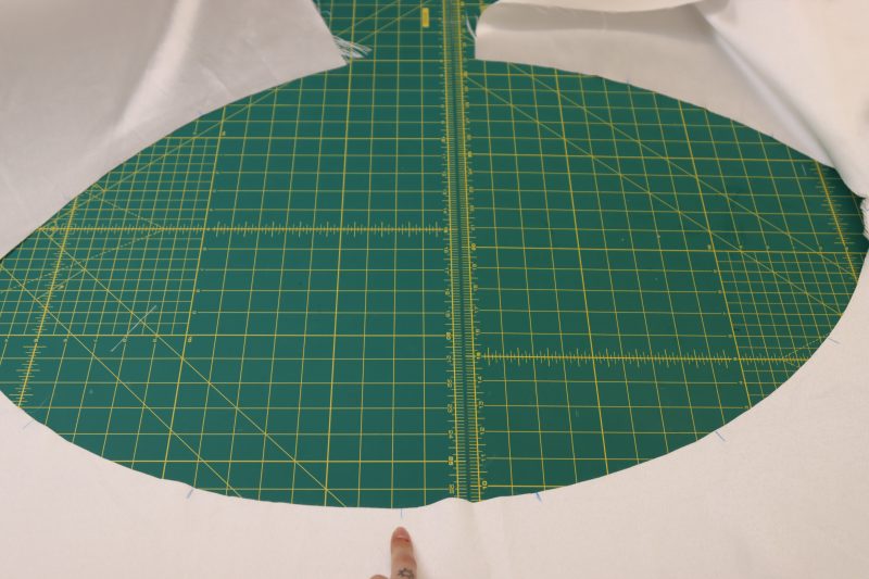 How To Match Pleat Marks Across Entire Skirt Waistline - Polyester Mikado - Mood Fabrics - Selenite V Waist Ballgown Free Sewing Pattern Tutorial - MDF515 - Mood Fabrics Sewciety Blog - Match the 6 pleats on the opposite side of the skirt waistline so that the chalk lines go around the entire waistline.