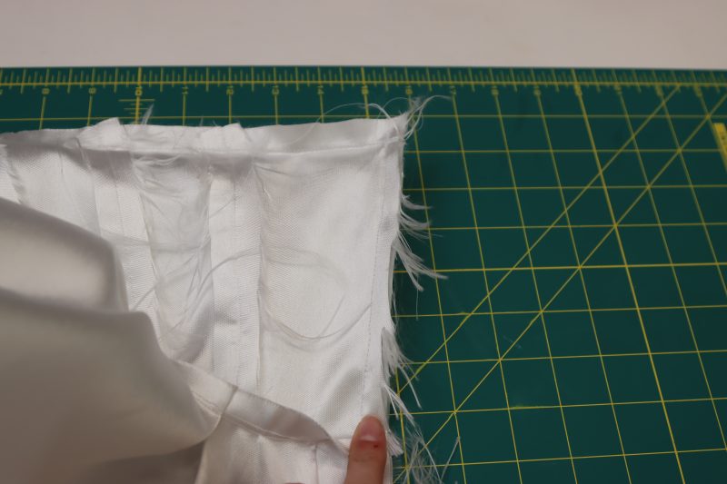 How To Sew Zipper Between Layers And Turn Out - Invisible Zipper - Mood Fabrics - Selenite V Waist Ballgown Free Sewing Pattern Tutorial - MDF515 - Mood Fabrics Sewciety Blog - Sew the other side of the zipper between the shell and the lining, then flip right sides out again.