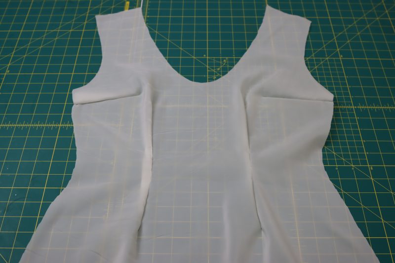 How To Sew Front Lining Darts - Stretch Polyester Twill Lining - Mood Fabrics - Deauville Cocktail Dress Free Sewing Pattern Tutorial - MDF517 - Mood Fabrics Sewciety Blog - Sew the front lining darts.
