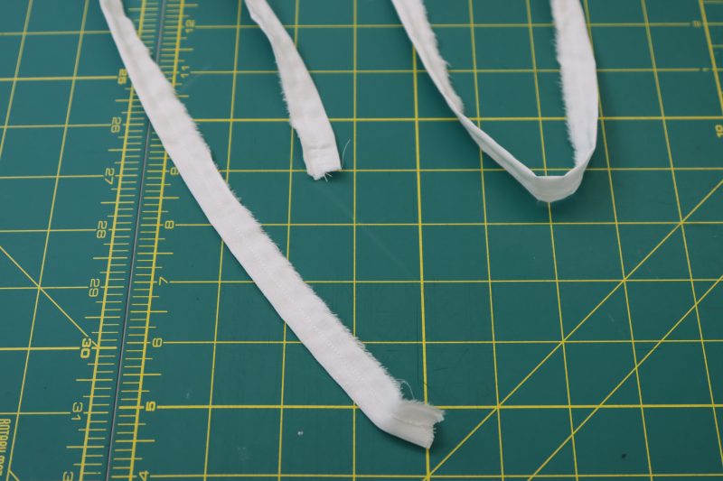 How To Sew Lacing Strips Right Sides Together - Cotton Voile - Mood Fabrics - Selenite V Waist Ballgown Free Sewing Pattern Tutorial - MDF515 - Mood Fabrics Sewciety Blog - Sew the strips in half with ¼ inch seam allowance.