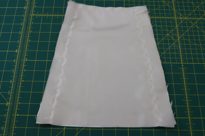 How To Sandwich Two Cuff Layers Together - Polyester Mikado - Mood Fabrics - Selenite V Waist Ballgown Free Sewing Pattern Tutorial - MDF515 - Mood Fabrics Sewciety Blog - Sandwich the loops between the two sleeve cuffs and sew around 3 edges.