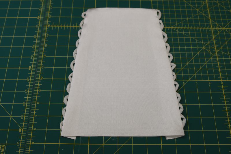 How To Turn Cuff Right Side Out And Press - Polyester Mikado - Mood Fabrics - Selenite V Waist Ballgown Free Sewing Pattern Tutorial - MDF515 - Mood Fabrics Sewciety Blog - Flip the cuff right sides out.