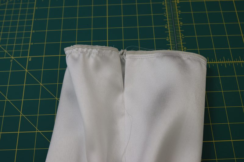 How To Topstitch Gap And Gather Sleeve Edge - Polyester Mikado - Mood Fabrics - Selenite V Waist Ballgown Free Sewing Pattern Tutorial - MDF515 - Mood Fabrics Sewciety Blog - Topstitch the sleeve gap and gather the end of the sleeve.