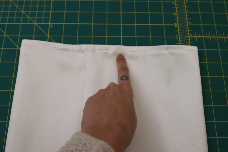 How To Sew Hem For Elastic Casing Leaving Opening - Polyester Mikado - Mood Fabrics - Selenite V Waist Ballgown Free Sewing Pattern Tutorial - MDF515 - Mood Fabrics Sewciety Blog - Hem the top of the sleeve with ⅜ inch seam allowance except for the gap for the elastic.