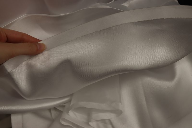 How To Hem Outer And Lining Skirt Final Edges - Polyester Mikado - Mood Fabrics - Selenite V Waist Ballgown Free Sewing Pattern Tutorial - MDF515 - Mood Fabrics Sewciety Blog - Hem the lining and the main skirt.