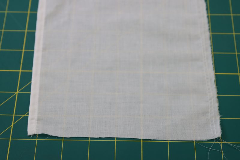 How To Sew Gathering Stitches Along Ruffle Edges - Cotton Voile - Mood Fabrics - Selenite V Waist Ballgown Free Sewing Pattern Tutorial - MDF515 - Mood Fabrics Sewciety Blog - Sew gathering stitches opposite to the hemmed edge of the ruffles.