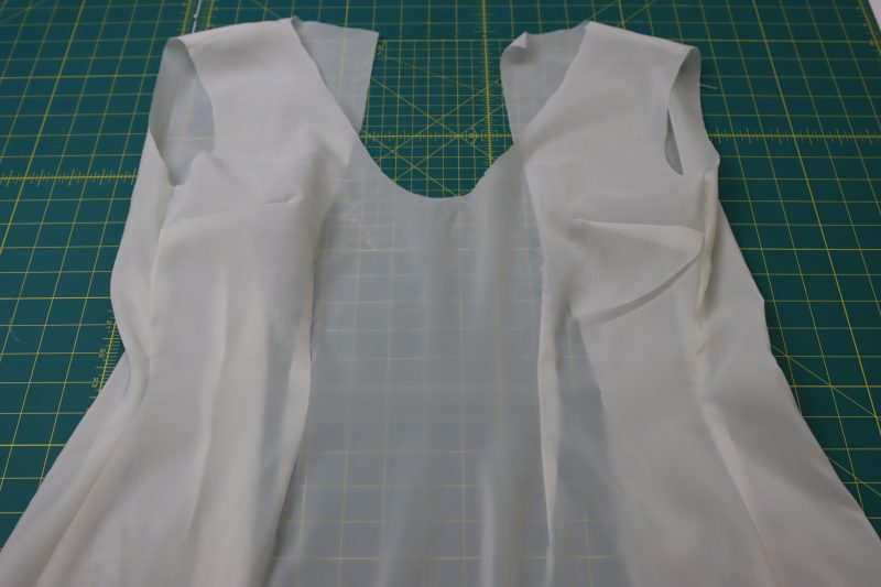 How To Sew Side And Shoulder Seams Of Lining Fabric - Stretch Polyester Twill Lining - Mood Fabrics - Deauville Cocktail Dress Free Sewing Pattern Tutorial - MDF517 - Mood Fabrics Sewciety Blog - Sew the side and shoulder seams of the lining fabric, too.