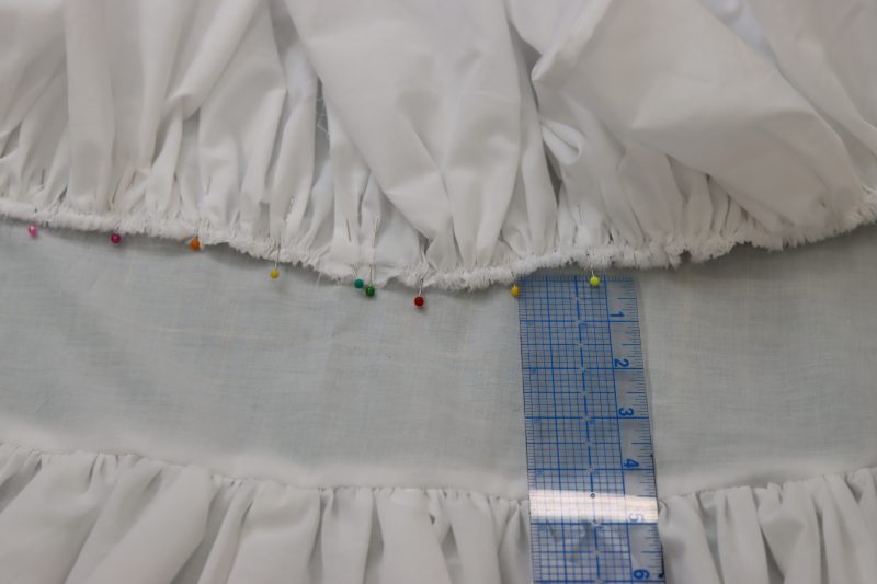 How To Measure Above Bottom Ruffle For Top Ruffle - Cotton Voile - Mood Fabrics - Selenite V Waist Ballgown Free Sewing Pattern Tutorial - MDF515 - Mood Fabrics Sewciety Blog - Measure 4.5 inches above the bottom ruffle.