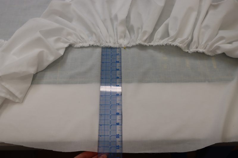 How To Measure From Petticoat Hem For Ruffle Placement - Cotton Voile - Mood Fabrics - Selenite V Waist Ballgown Free Sewing Pattern Tutorial - MDF515 - Mood Fabrics Sewciety Blog - Measure 11.5 inches from the bottom hem of the petticoat.