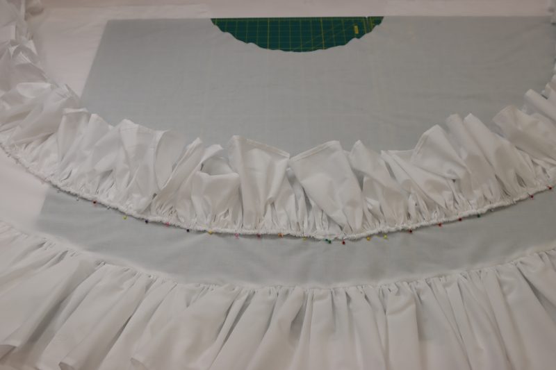 How To Pin Top Ruffle Above Bottom Ruffle Line - Cotton Voile - Mood Fabrics - Selenite V Waist Ballgown Free Sewing Pattern Tutorial - MDF515 - Mood Fabrics Sewciety Blog - Pin the top ruffle 4.5 inches above the bottom ruffle.