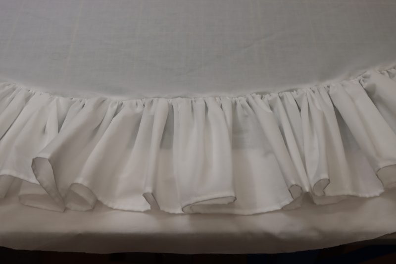 How To Sew Bottom Ruffle At Measured Distance - Cotton Voile - Mood Fabrics - Selenite V Waist Ballgown Free Sewing Pattern Tutorial - MDF515 - Mood Fabrics Sewciety Blog - Sew the bottom ruffle 11.5 inches away from the bottom hem.