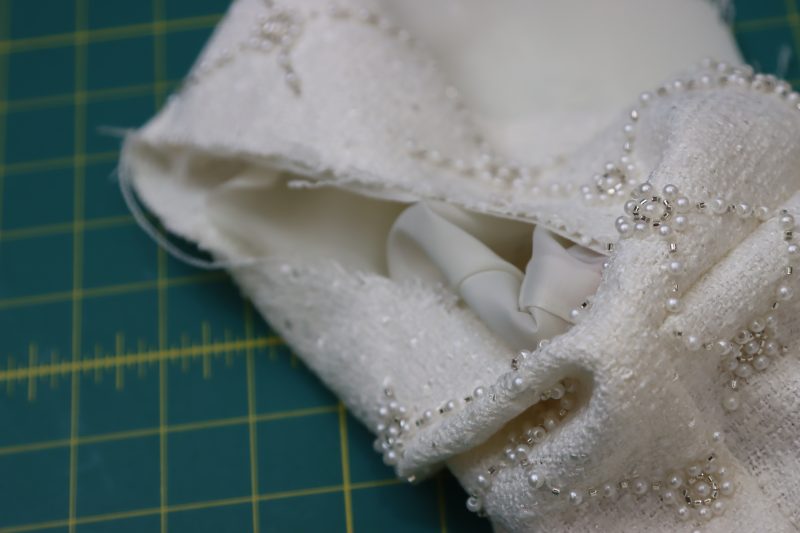 How To Pinch Lining And Main Fabric Right Sides Together - Stretch Polyester Twill Lining - Mood Fabrics - Deauville Cocktail Dress Free Sewing Pattern Tutorial - MDF517 - Mood Fabrics Sewciety Blog - Pinch the lining and main fabric right sides together
