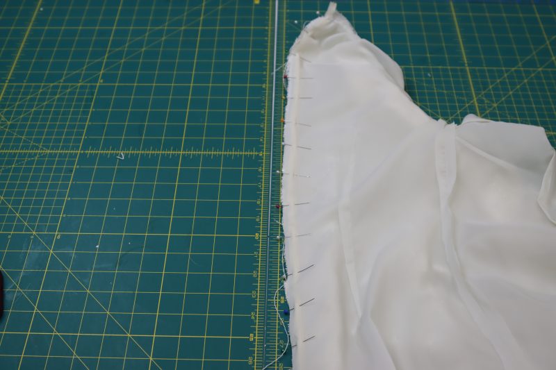 How To Pin Opposite Side Of Zipper To Center Back Seam - Invisible Zipper - Mood Fabrics - Deauville Cocktail Dress Free Sewing Pattern Tutorial - MDF517 - Mood Fabrics Sewciety Blog - Pin the opposite side of the zipper to the opposite side of the center back seam.