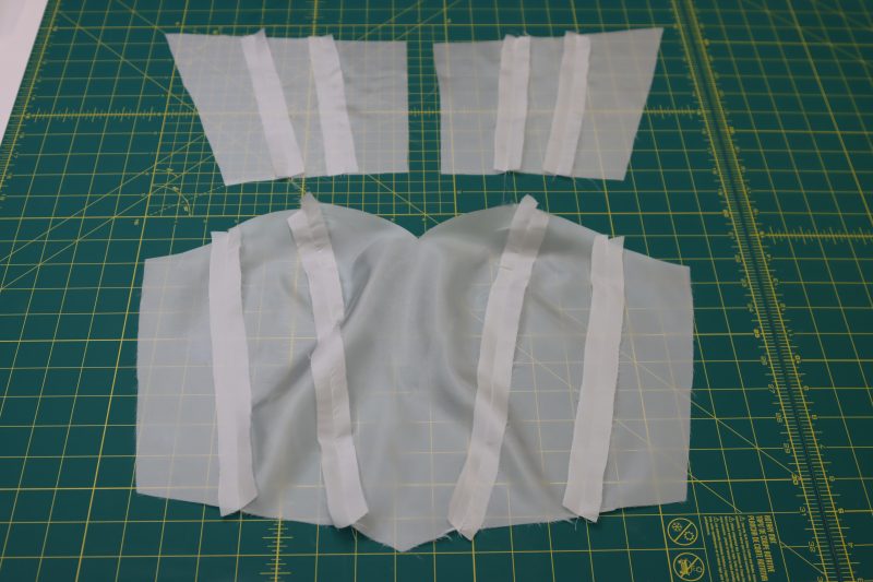 How To Pin Sew Bodice Lining Pieces Together - Polyester Lining - Mood Fabrics - Selenite V Waist Ballgown Free Sewing Pattern Tutorial - MDF515 - Mood Fabrics Sewciety Blog - Pin and sew the bodice lining pieces right sides together.