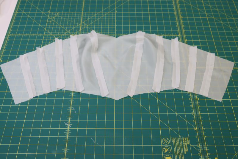 How To Press Bodice Lining Seams Open And Flat - Polyester Lining - Mood Fabrics - Selenite V Waist Ballgown Free Sewing Pattern Tutorial - MDF515 - Mood Fabrics Sewciety Blog - Press the bodice lining seams open and flat.