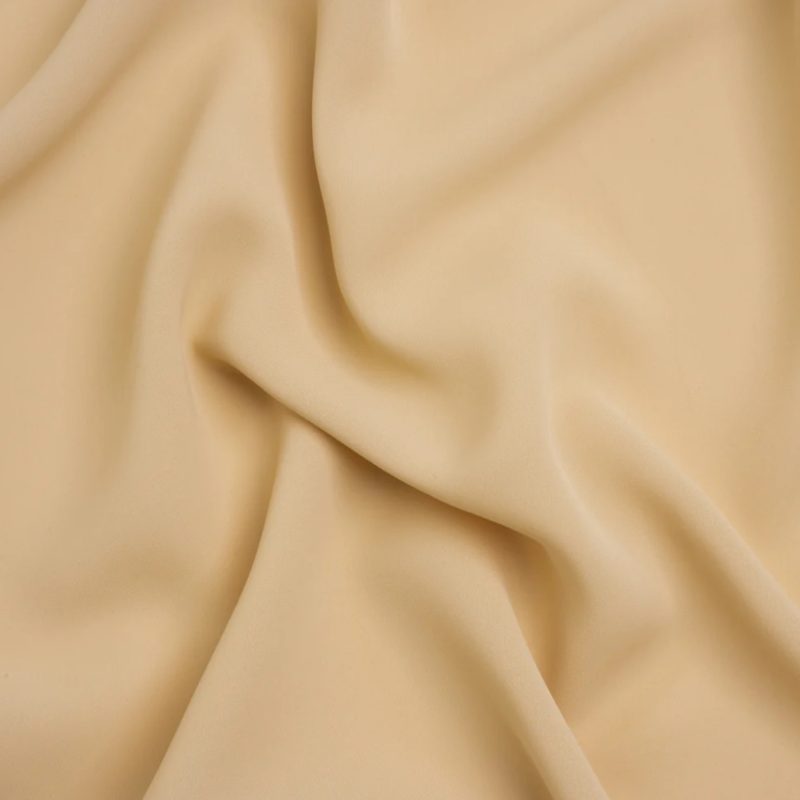 Polyester Double Georgette - Cashmere - Mimosa Collection by Mood fabric perfect for Free Resort Outfit Sewing Projects such as the Thelma Halter Top Louise Wide Leg Pants Sewing Pattern free PDF download from Mood Fabrics Sewciety Blog.