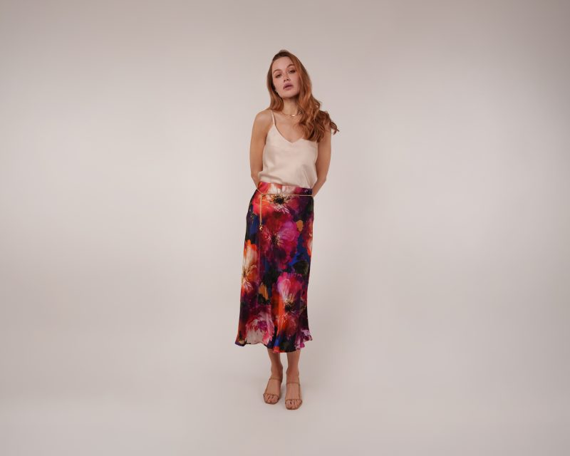 Model wearing Hana Bias Cut Dress Indigo Skirt Sewing Pattern posing for Resort Wear Sewing Project Ideas. Free Sewing Pattern PDF from Mood Fabrics Sewciety Blog.