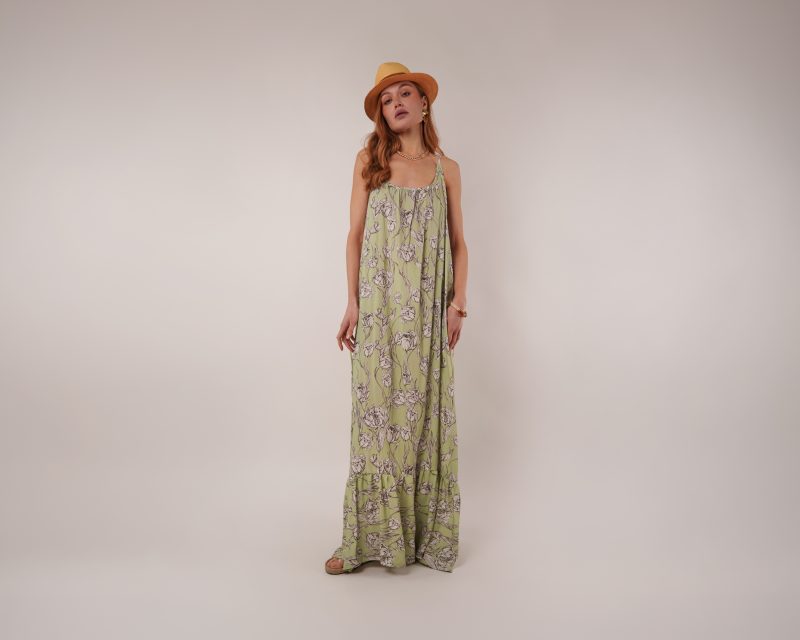 Model wearing Vero Beach Dress Sewing Pattern posing for Resort Wear Sewing Project Ideas. Free Sewing Pattern PDF from Mood Fabrics Sewciety Blog.