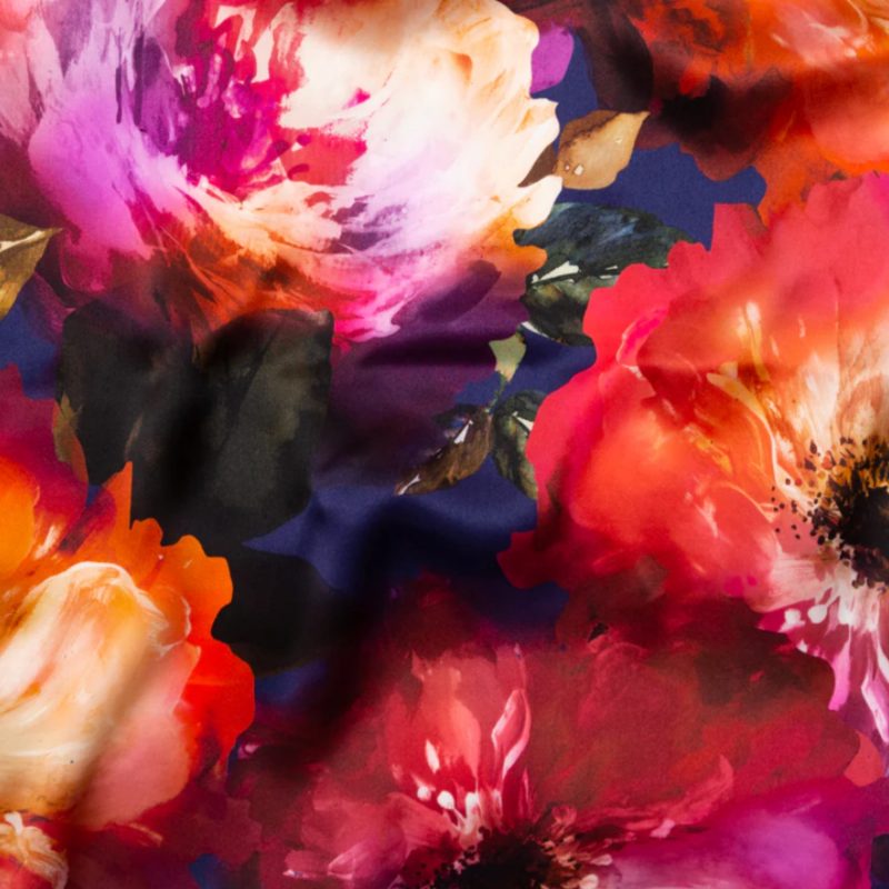 Mood Exclusive Italian Pink, Orange and Blue Painterly Floral Digitally Printed Silk Charmeuse fabric perfect for Free Resort Outfit Sewing Projects such as the Hana Bias Cut Dress Indigo Skirt Sewing Pattern free PDF download from Mood Fabrics Sewciety Blog.