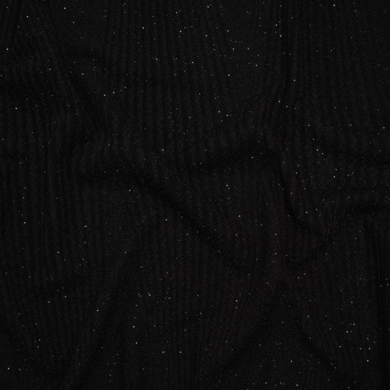 Stretch Crepe Knit with Silver Glitter - Black Geometric Lines - Designer Deadstock fabric perfect for Free Resort Outfit Sewing Projects such as the Cirrus Romper Sewing Pattern free PDF download from Mood Fabrics Sewciety Blog.