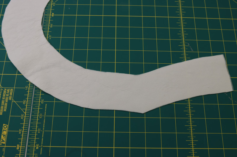 How To Press Fusible Interfacing To The Neckline Facings - Fusible Interfacing - Mood Fabrics - Merano Balloon Sleeve Blouse Free Sewing Pattern Tutorial - MDF522 - Mood Fabrics Sewciety Blog - Press fusible interfacing to the neckline facings.