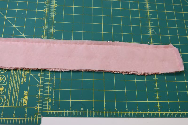 How To Clip Corners Of The Waistband - Baby Sequin Mesh - Mood Fabrics - Morganite Waistcoat Ensemble Free Sewing Pattern Tutorial - MDF519 - Mood Fabrics Sewciety Blog - Clip the corners of the waistband.