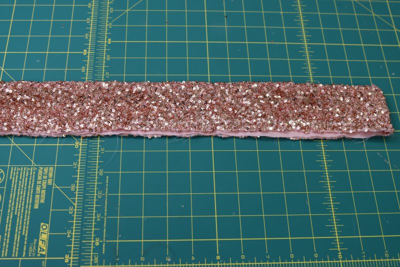 How To Flip Waistband Right Sides Out - Baby Sequin Mesh - Mood Fabrics - Morganite Waistcoat Ensemble Free Sewing Pattern Tutorial - MDF519 - Mood Fabrics Sewciety Blog - Flip the waistband right sides out.