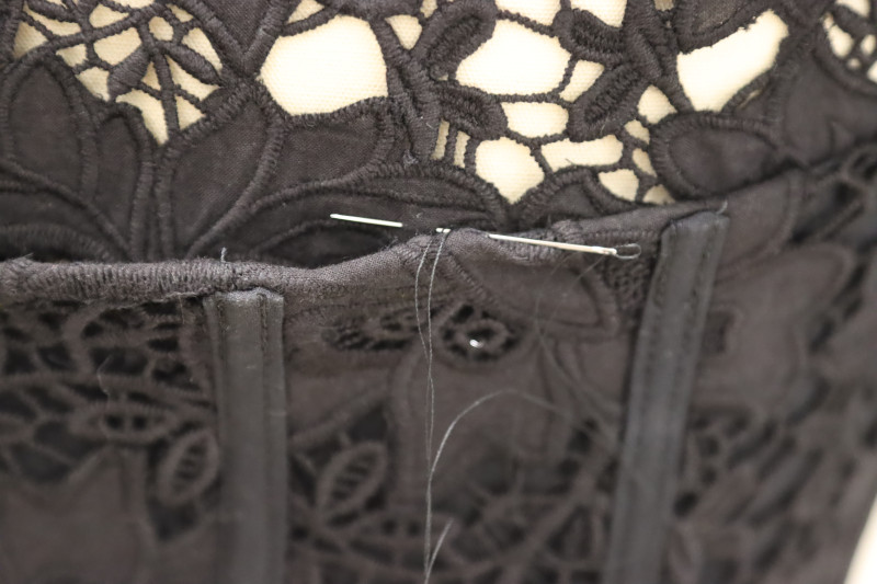 How To Sew Top Of Dress To Lining Of Corset By Hand - Cotton Voile - Mood Fabrics - Reims Soirée Dress Free Sewing Pattern Tutorial - MDF521 - Mood Fabrics Sewciety Blog - Hand sew the top of the dress to the lining of the corset.
