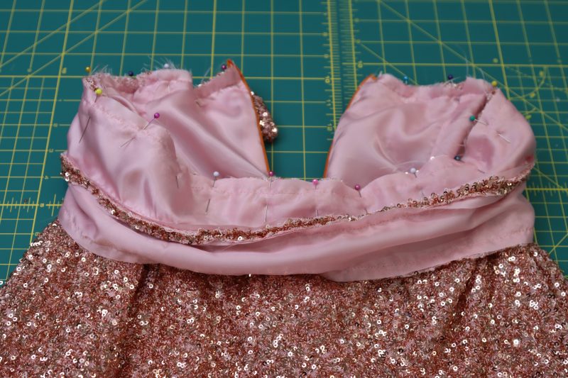 How To Flip Waistband Right Sides Out - Baby Sequin Mesh - Mood Fabrics - Morganite Waistcoat Ensemble Free Sewing Pattern Tutorial - MDF519 - Mood Fabrics Sewciety Blog - Flip the waistband right sides out.