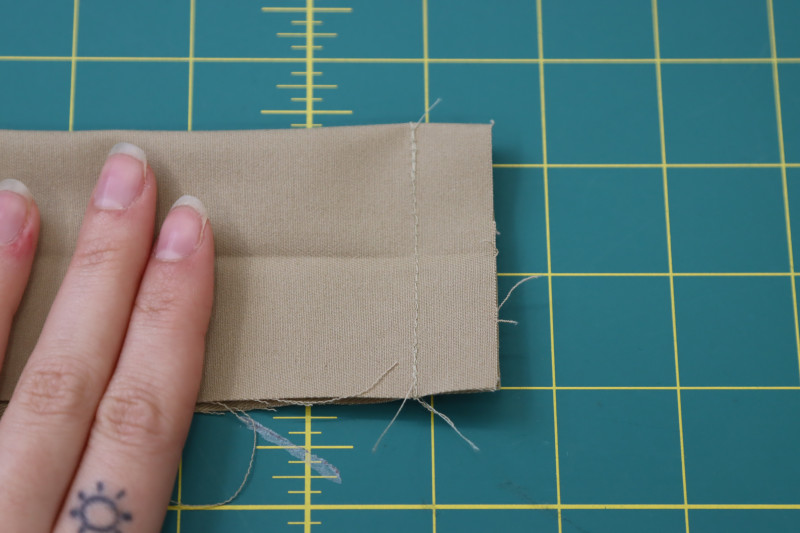 How To Sew Ends Of Waistband Shut - Stretch Khaki Twill - Mood Fabrics - Lucca Tailored Barrel Leg Pants Free Sewing Pattern Tutorial - MDF524 - Mood Fabrics Sewciety Blog - Sew the ends of the waistband shut.
