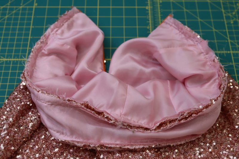 How To Sew The Waistband To The Waistline Of The Pants - Baby Sequin Mesh - Mood Fabrics - Morganite Waistcoat Ensemble Free Sewing Pattern Tutorial - MDF519 - Mood Fabrics Sewciety Blog - Sew the waistband to the waistline of the pants.