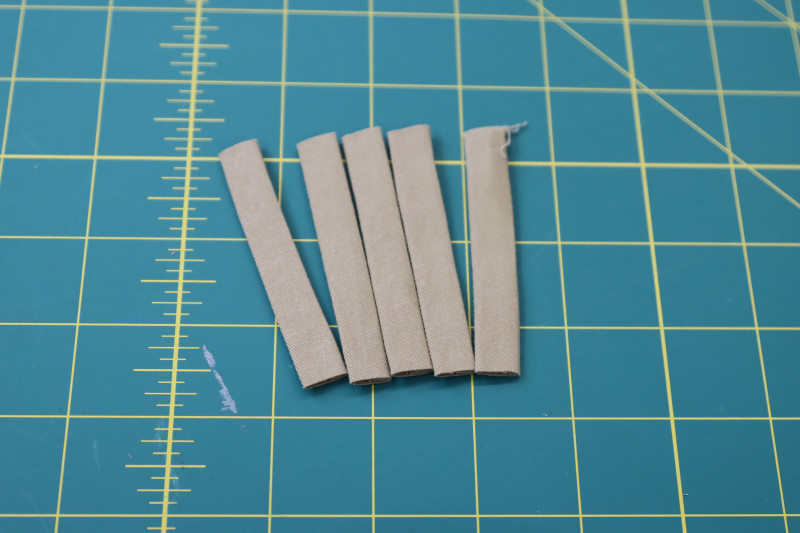 How To Cut Tube Into 5 Equally Sized Strips - Stretch Khaki Twill - Mood Fabrics - Lucca Tailored Barrel Leg Pants Free Sewing Pattern Tutorial - MDF524 - Mood Fabrics Sewciety Blog - Cut the tube into 5 equally sized strips.